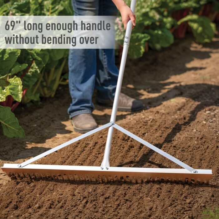 The landscape rake in action, spreading gravel on a lawn using the powerful garden tools design.