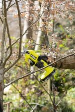 The Ryobi garden tools secateurs compatible with the ONE+ battery system, shown with compatible tools.